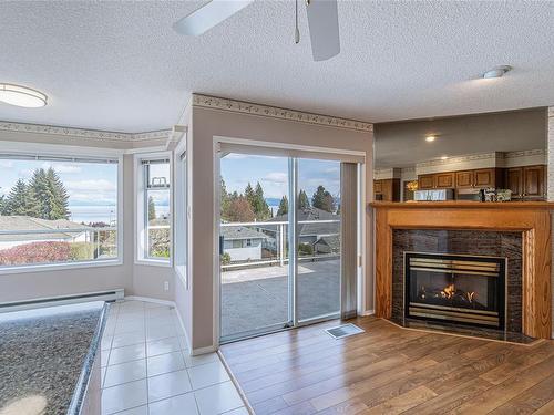 5658 Malibu Terr, Nanaimo, BC - Indoor Photo Showing Living Room With Fireplace