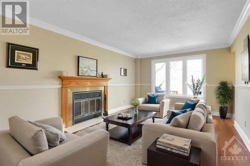 virtually staged - 1689 Des Ravins Place, Orleans, ON - Indoor Photo Showing Living Room With Fireplace