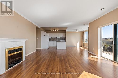 #512 -60 Wyndham St S, Guelph, ON - Indoor Photo Showing Living Room With Fireplace