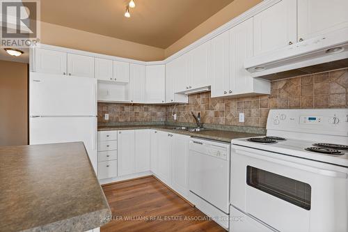 #512 -60 Wyndham St S, Guelph, ON - Indoor Photo Showing Kitchen With Double Sink
