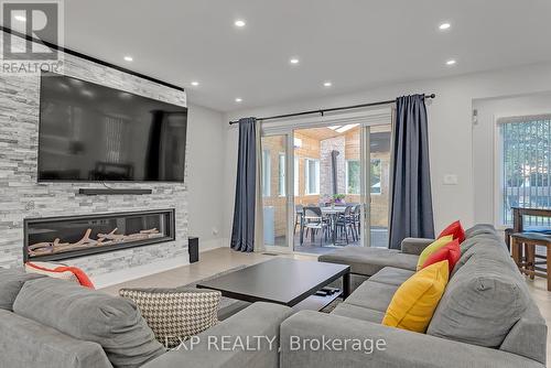 393 Burnhamthorpe Rd, Toronto, ON - Indoor Photo Showing Living Room With Fireplace
