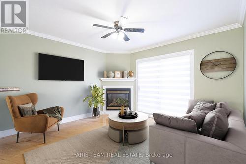 11 - 90 Burke Street, Penetanguishene, ON - Indoor Photo Showing Living Room With Fireplace