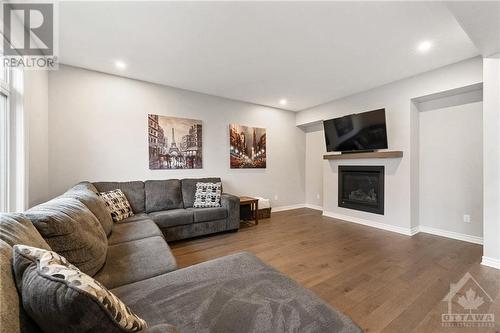 10 Honfleur Street, Ottawa, ON - Indoor Photo Showing Living Room With Fireplace