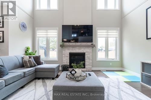 56 Burton St E, East Zorra-Tavistock, ON - Indoor Photo Showing Living Room With Fireplace