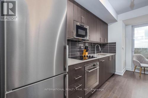 #803 -2550 Simcoe St N, Oshawa, ON - Indoor Photo Showing Kitchen With Stainless Steel Kitchen