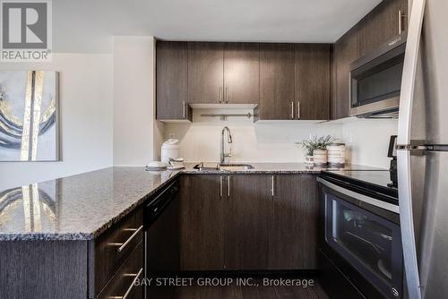 #305 -1070 Progress Ave, Toronto, ON - Indoor Photo Showing Kitchen With Upgraded Kitchen