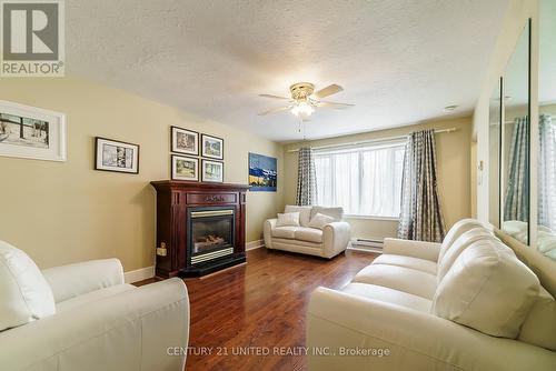 899 Cumberland Ave, Peterborough, ON - Indoor Photo Showing Living Room With Fireplace