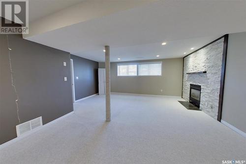 159 Michener Drive, Regina, SK - Indoor Photo Showing Basement With Fireplace