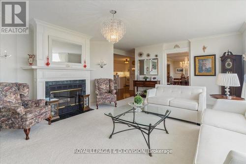 #Ph04 -1800 The Collegeway, Mississauga, ON - Indoor Photo Showing Living Room With Fireplace