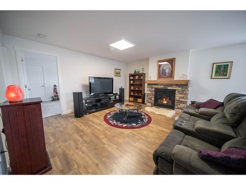 102 18Th Street S, Cranbrook, BC - Indoor Photo Showing Living Room With Fireplace