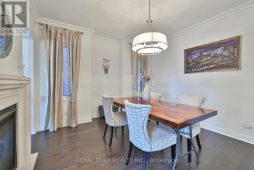 227 Frederick Curran Lane, Newmarket, ON - Indoor Photo Showing Dining Room With Fireplace
