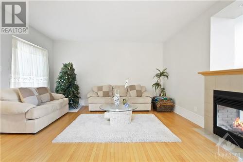 5090 North Bluff Drive, Ottawa, ON - Indoor Photo Showing Living Room With Fireplace