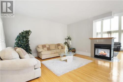 5090 North Bluff Drive, Ottawa, ON - Indoor Photo Showing Living Room With Fireplace