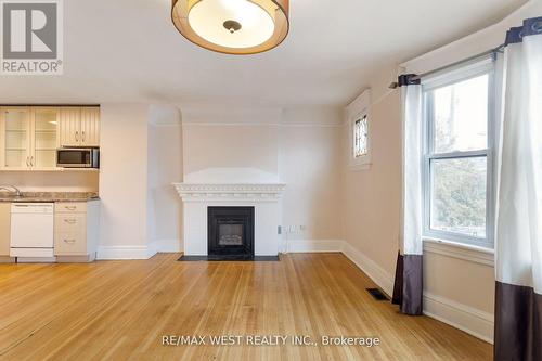 96 Roncesvalles Avenue, Toronto (High Park-Swansea), ON - Indoor Photo Showing Other Room With Fireplace