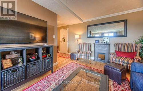 607 - 58 Bridgeport Road E, Waterloo, ON - Indoor Photo Showing Living Room With Fireplace