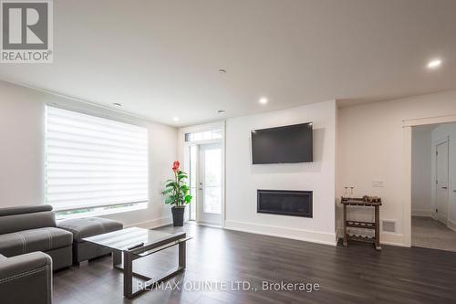 407 - 17 Cleave Avenue, Prince Edward County (Picton), ON - Indoor Photo Showing Living Room With Fireplace