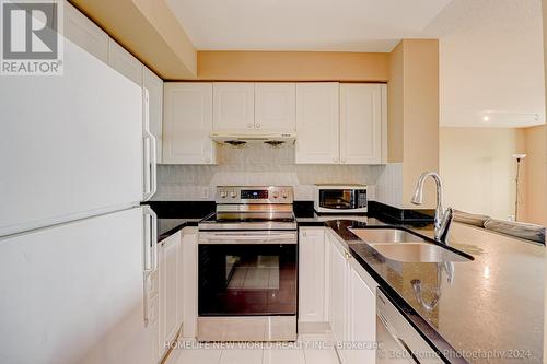 #Ph#105 -1 Lee Centre Dr, Toronto, ON - Indoor Photo Showing Kitchen With Double Sink