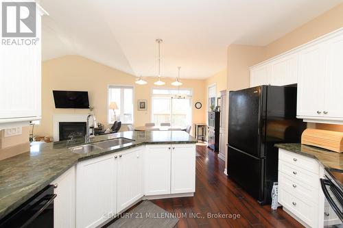 12 Surfside Crescent, Collingwood, ON - Indoor Photo Showing Kitchen With Fireplace With Double Sink