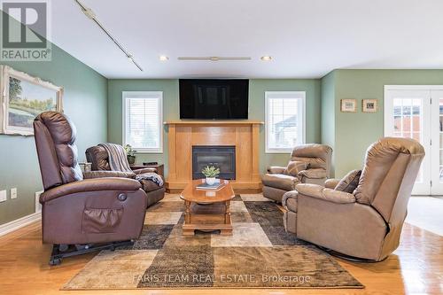 23 Bourgeois Beach Road, Tay, ON - Indoor Photo Showing Living Room With Fireplace