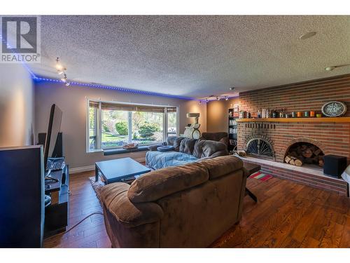 3808 Forsyth Drive, Penticton, BC - Indoor Photo Showing Living Room With Fireplace