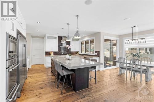 Family-friendly peninsula island in the kitchen is perfect for the busy household or hosting large gatherings. Its spacious design provides ample room for casual dining, socializing or a central h - 52 Moore Street, Ottawa, ON - Indoor Photo Showing Dining Room
