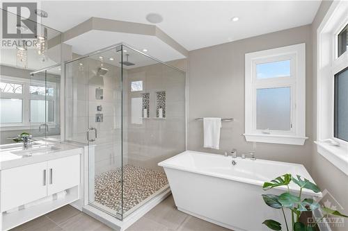 Escape and relax with impressive soaker tubs or multi-function shower options in this inviting space, designed for ultimate relaxation. - 52 Moore Street, Ottawa, ON - Indoor Photo Showing Bathroom