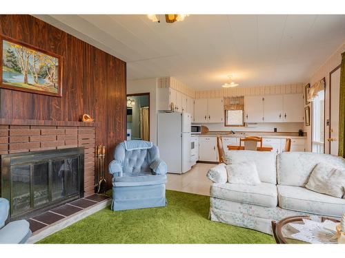 8988 Beach Street, Balfour, BC - Indoor Photo Showing Living Room With Fireplace