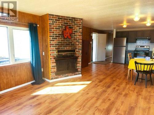 60-833 Range Road, Whitehorse, YT - Indoor Photo Showing Living Room With Fireplace