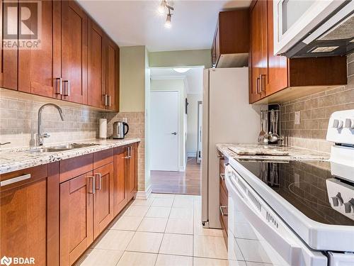 3100 Kirwin Avenue Unit# 2504, Mississauga, ON - Indoor Photo Showing Kitchen With Double Sink