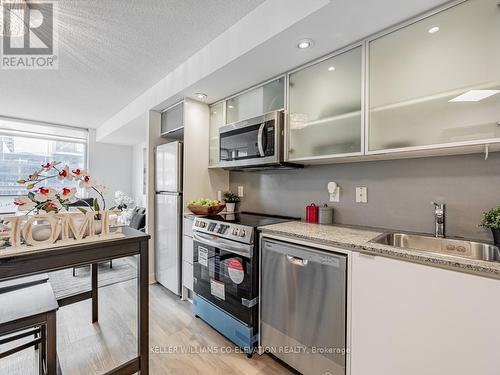 #301 -25 Telegram Mews, Toronto, ON - Indoor Photo Showing Kitchen With Stainless Steel Kitchen With Upgraded Kitchen