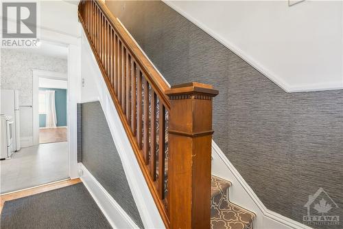 Traditional handrail by stairs to the 2nd floor - 321 Lisgar Avenue, Renfrew, ON - Indoor Photo Showing Other Room