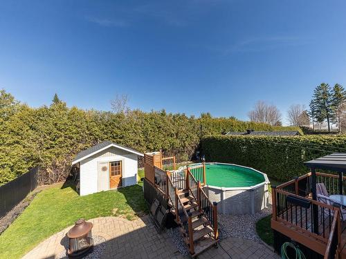 Backyard - 59 Rue Hemmings, Saint-Jean-Sur-Richelieu, QC - Outdoor With Above Ground Pool