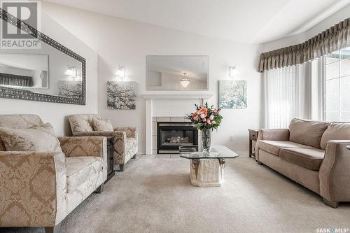 113 835 Heritage Green, Saskatoon, SK - Indoor Photo Showing Living Room With Fireplace