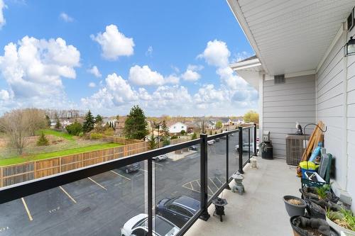 Beautiful long balcony overlooks the greenspace beyond. - 67 Haddington Street|Unit #304, Caledonia, ON - Outdoor With Balcony With Exterior