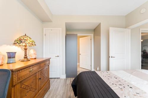Primary bedroom has large closet and private ensuite bath. - 67 Haddington Street|Unit #304, Caledonia, ON - Indoor Photo Showing Bedroom
