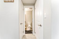 Main 4-pc bath, entry to coat closet and laundry area - all tucked neatly out of site. - 