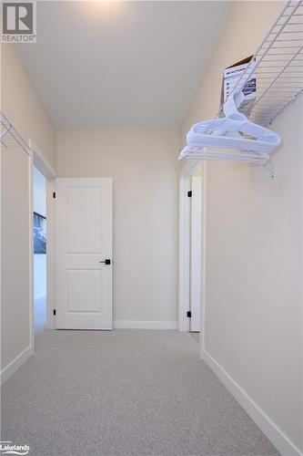 Walk in closet - Primary Bedroom - 1020 Ridgeline Drive, Lake Of Bays (Twp), ON - Indoor Photo Showing Other Room