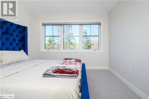 2nd floor bedroom #3 looking onto forest - 1020 Ridgeline Drive, Lake Of Bays (Twp), ON - Indoor Photo Showing Bedroom