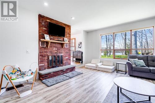 21088 Pier Road, Wheatley, ON - Indoor Photo Showing Living Room With Fireplace