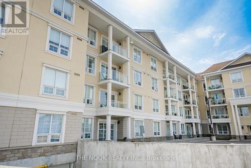 #415 -21 Brookhouse Dr, Clarington, ON - Outdoor With Balcony With Facade