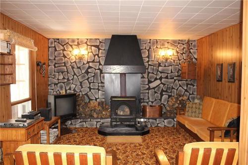 108 Old Arnes Place, Silver Harbour, MB - Indoor With Fireplace