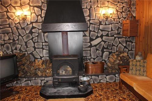108 Old Arnes Place, Silver Harbour, MB - Indoor With Fireplace