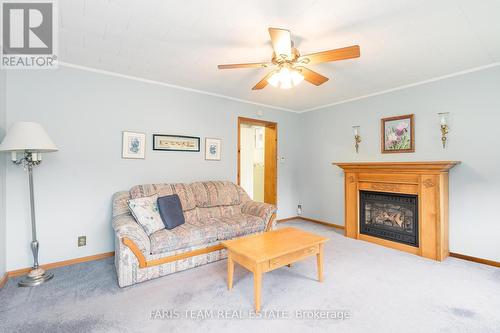 303 Ouida Street, Tay, ON - Indoor Photo Showing Living Room With Fireplace