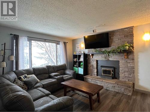 8716 91 Avenue, Fort St. John, BC - Indoor Photo Showing Living Room With Fireplace