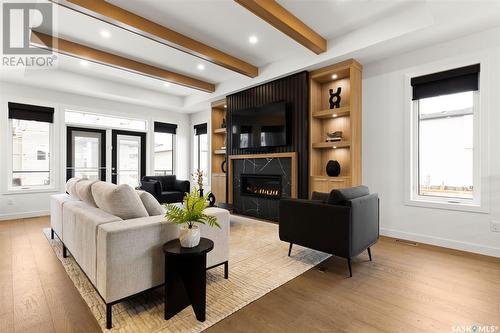 4143 Fieldstone Way, Regina, SK - Indoor Photo Showing Living Room With Fireplace