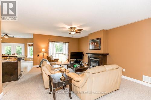 80 O'Neill Circ, Springwater, ON - Indoor Photo Showing Living Room With Fireplace