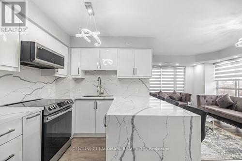 #412 -30 Meadowglen Pl, Toronto, ON - Indoor Photo Showing Kitchen With Upgraded Kitchen