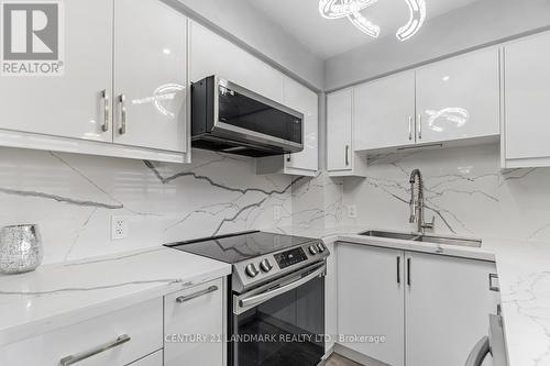#412 -30 Meadowglen Pl, Toronto, ON - Indoor Photo Showing Kitchen With Double Sink With Upgraded Kitchen