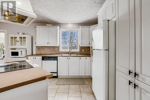 5207 County Rd 10 Road, Fournier, ON - Indoor Photo Showing Kitchen With Double Sink