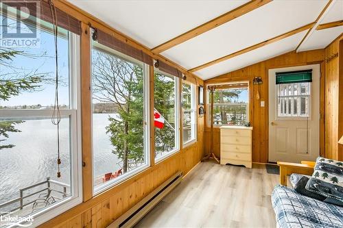 1024 Marys Lane, Algonquin Highlands, ON - Indoor Photo Showing Other Room With Body Of Water